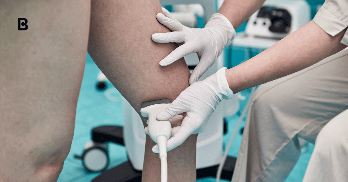 Doctor in white uniform with diagnostic equipment performs an ultrasound examination of vascular health